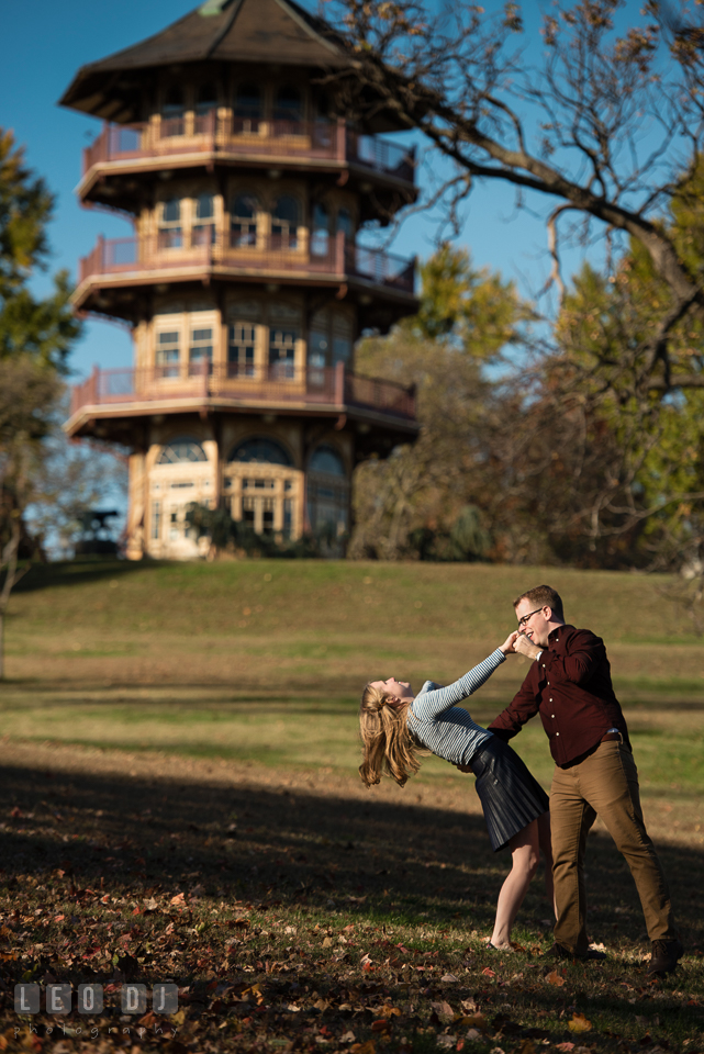 Patterson Park Baltimore Maryland engaged girl dancing with fiance by pagoda photo by Leo Dj Photography.