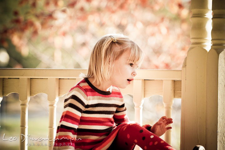 girl looking at something. Fun candid family children lifestyle photographer Annapolis Maryland