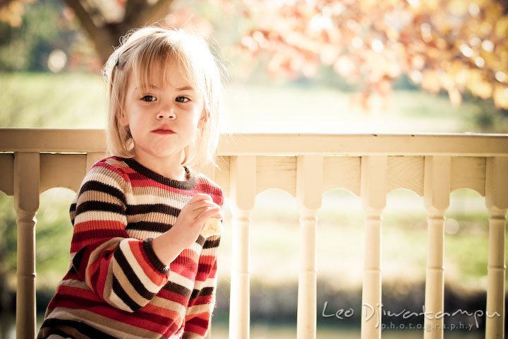girl eating her snack. Fun candid family children lifestyle photographer Annapolis Maryland