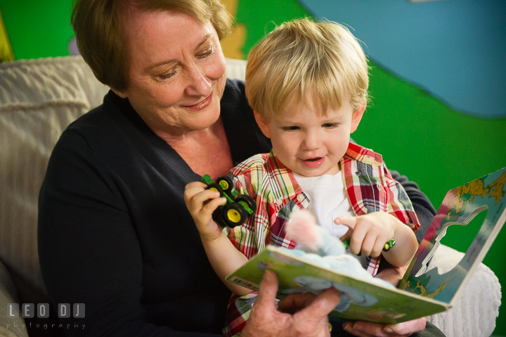 Grandmother reading book to his little grandson. Queenstown, Eastern Shore Maryland candid children and family lifestyle portrait photo session by photographers of Leo Dj Photography. http://leodjphoto.com