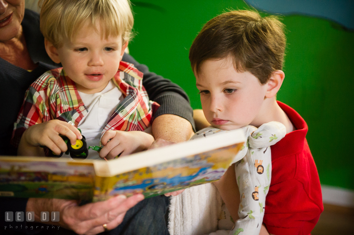 Two boys reading books together with their Grandmother. Queenstown, Eastern Shore Maryland candid children and family lifestyle portrait photo session by photographers of Leo Dj Photography. http://leodjphoto.com