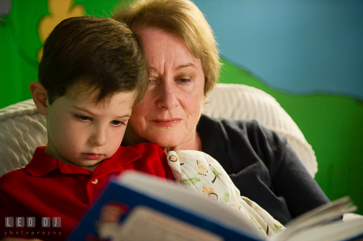 Toddler boy reading book together with his Grandmother. Queenstown, Eastern Shore Maryland candid children and family lifestyle portrait photo session by photographers of Leo Dj Photography. http://leodjphoto.com