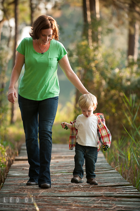 Mother walking with his young son. Queenstown, Eastern Shore Maryland candid children and family lifestyle portrait photo session by photographers of Leo Dj Photography. http://leodjphoto.com