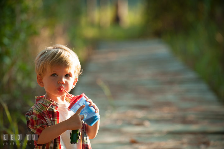 Little boy drinking chocolate milk. Queenstown, Eastern Shore Maryland candid children and family lifestyle portrait photo session by photographers of Leo Dj Photography. http://leodjphoto.com