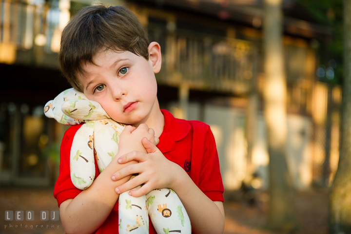 Toddler boy showing and hugging his favorite stuffed animal toy. Queenstown, Eastern Shore Maryland candid children and family lifestyle portrait photo session by photographers of Leo Dj Photography. http://leodjphoto.com