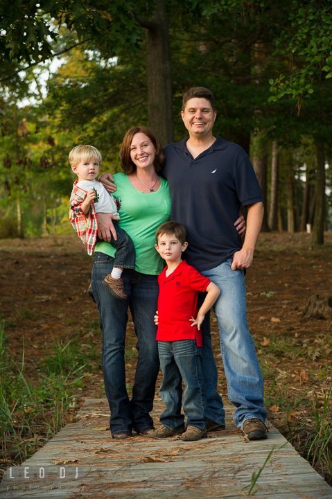 Mom, Dad, and their sons posing. Queenstown, Eastern Shore Maryland candid children and family lifestyle portrait photo session by photographers of Leo Dj Photography. http://leodjphoto.com