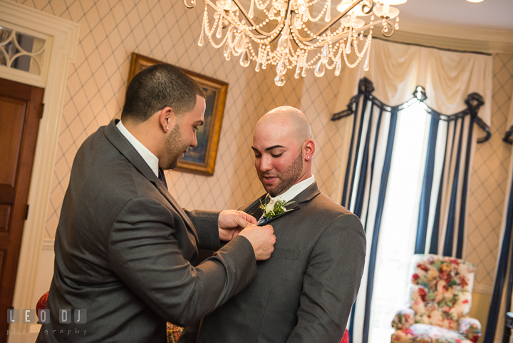 Best Man and Brother putting on the boutonniere. The Tidewater Inn Wedding, Easton Maryland, getting ready photo coverage by wedding photographers of Leo Dj Photography. http://leodjphoto.com