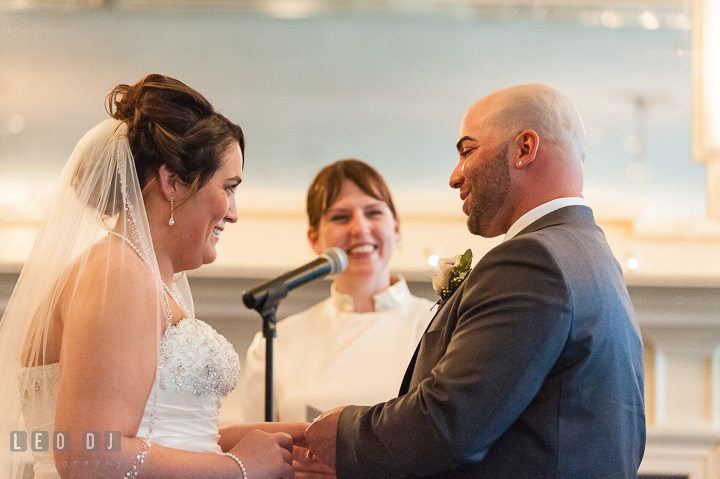 Bride and Groom exchanging wedding rings. The Tidewater Inn Wedding, Easton Maryland, ceremony photo coverage by wedding photographers of Leo Dj Photography. http://leodjphoto.com