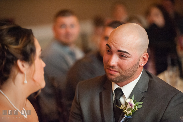 Groom looking at Bride at sweet heart table during speech. The Tidewater Inn Wedding, Easton Maryland, reception photo coverage by wedding photographers of Leo Dj Photography. http://leodjphoto.com