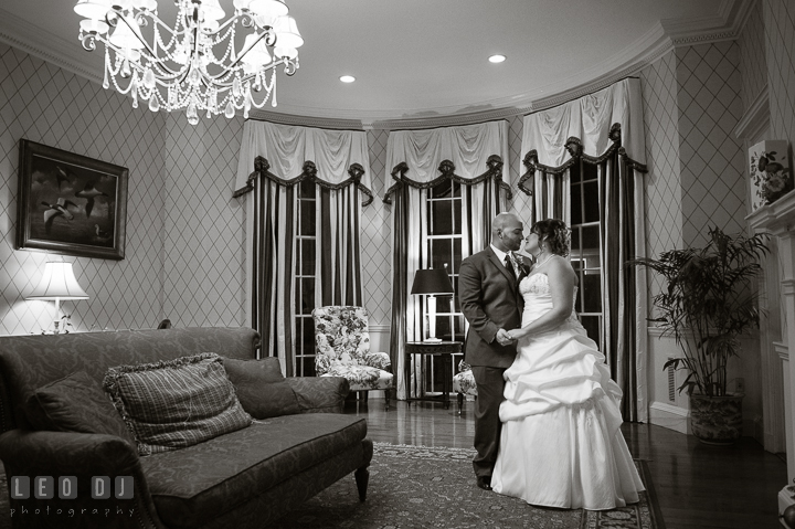 Bride and Groom in a beautiful room with antique furnitures and decorations. The Tidewater Inn Wedding, Easton Maryland, reception photo coverage by wedding photographers of Leo Dj Photography. http://leodjphoto.com