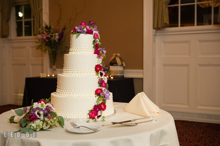 Four tier cake from Julie Bakes decorated with flowers from Seaberry Farm. The Tidewater Inn Wedding, Easton Maryland, reception photo coverage by wedding photographers of Leo Dj Photography. http://leodjphoto.com