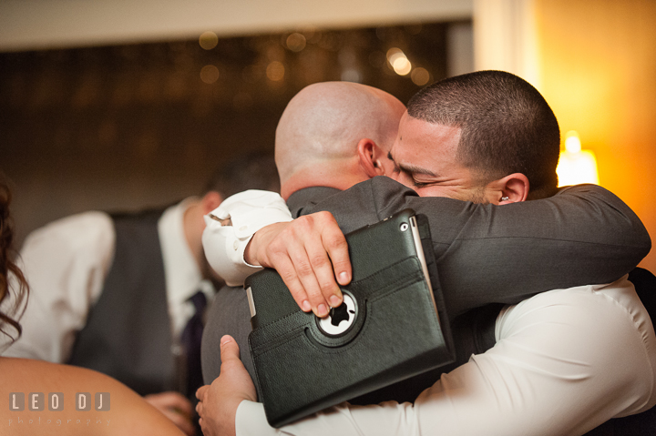 Groom hugged Best Man and Brother after speech. The Tidewater Inn Wedding, Easton Maryland, reception photo coverage by wedding photographers of Leo Dj Photography. http://leodjphoto.com