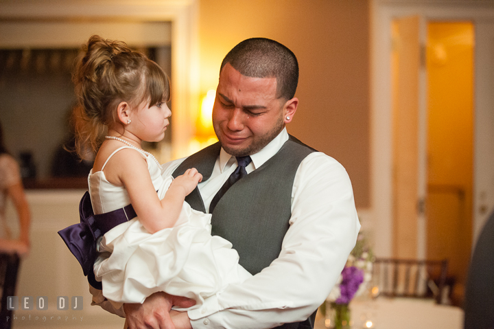 Flower girl looking at Best Man and uncle crying. The Tidewater Inn Wedding, Easton Maryland, reception photo coverage by wedding photographers of Leo Dj Photography. http://leodjphoto.com