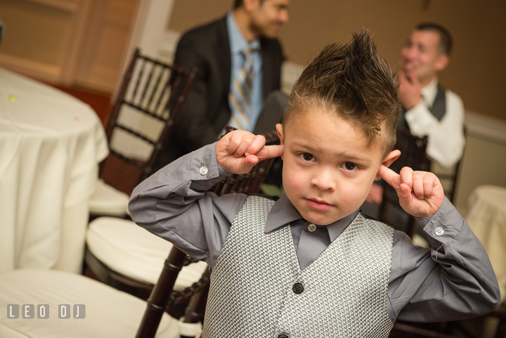 Ring bearer boy cover ears due to loud music. The Tidewater Inn Wedding, Easton Maryland, reception photo coverage by wedding photographers of Leo Dj Photography. http://leodjphoto.com