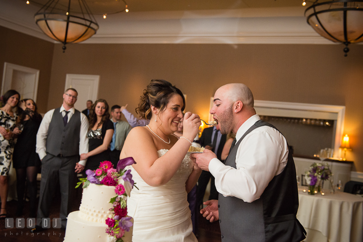 Bride and Groom feeding cake to each other. The Tidewater Inn Wedding, Easton Maryland, reception photo coverage by wedding photographers of Leo Dj Photography. http://leodjphoto.com