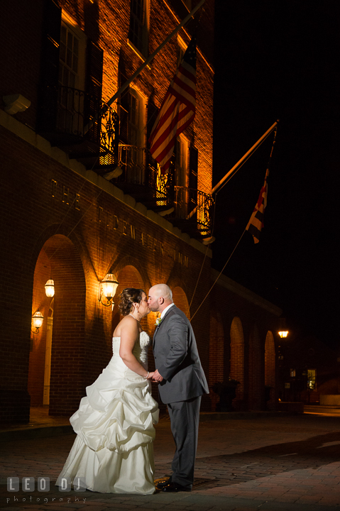 Bride and Groom kissing in front of the venue entrance. The Tidewater Inn Wedding, Easton Maryland, reception photo coverage by wedding photographers of Leo Dj Photography. http://leodjphoto.com