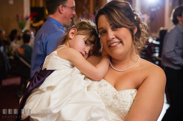 Bride carrying her daughter, the flower girl. The Tidewater Inn Wedding, Easton Maryland, reception photo coverage by wedding photographers of Leo Dj Photography. http://leodjphoto.com