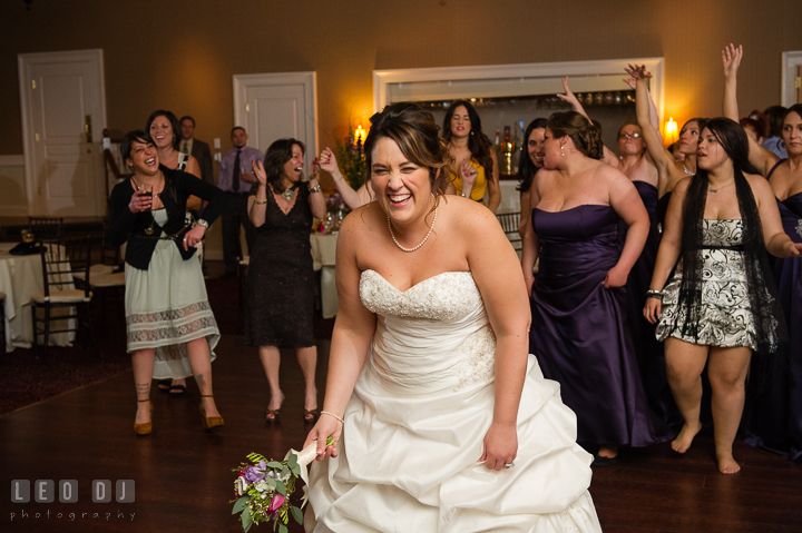 Bride laughing, getting ready to toss the flower bouquet to the single ladies. The Tidewater Inn Wedding, Easton Maryland, reception photo coverage by wedding photographers of Leo Dj Photography. http://leodjphoto.com