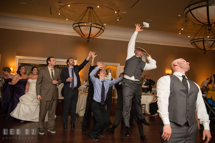 Groom tossed the garter to the single men crowd. The Tidewater Inn Wedding, Easton Maryland, reception photo coverage by wedding photographers of Leo Dj Photography. http://leodjphoto.com