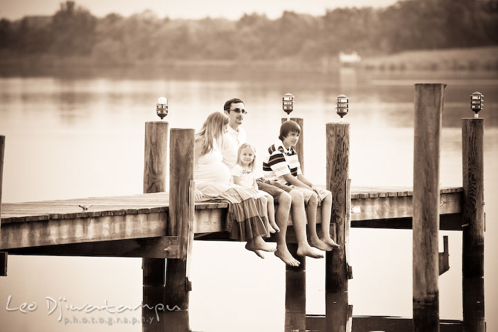 Family sitting on pier, bare feet. Kent Island and Annapolis, Eastern Shore, Maryland Candid Family Maternity Session Photographer