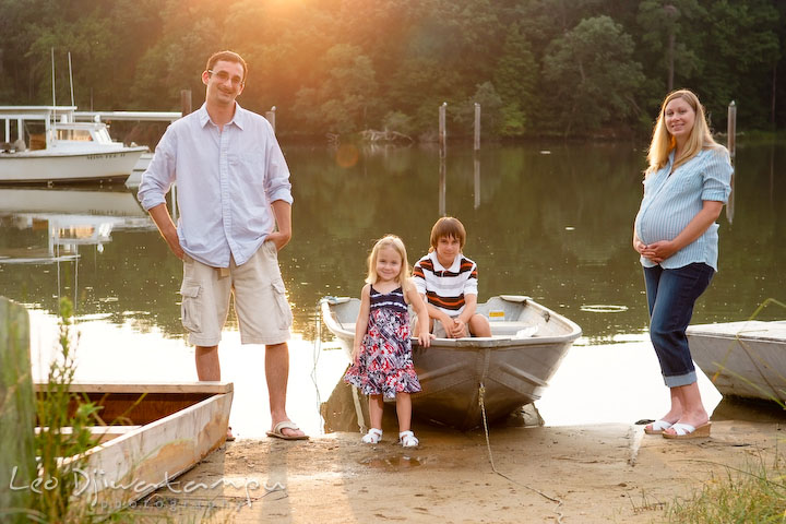 Whole family posing by the water and boat. Kent Island and Annapolis, Eastern Shore, Maryland Candid Family Maternity Session Photographer