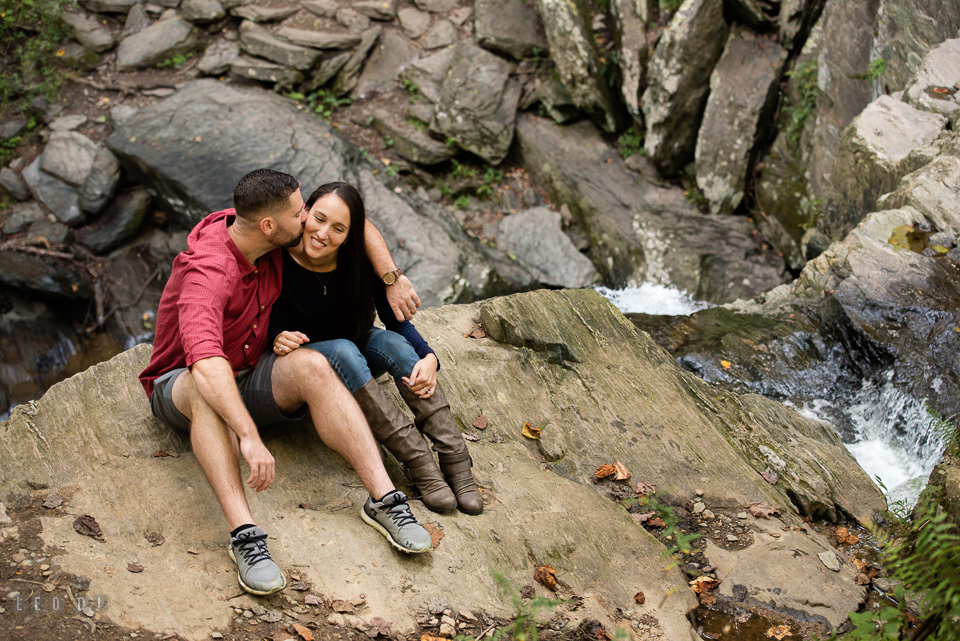 Rocks State Park Bel Air Maryland engaged man kiss fiancée by waterfall photo by Leo Dj Photography.