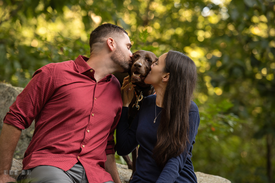 Rocks State Park Bel Air Maryland engaged girl and fiance kiss dog photo by Leo Dj Photography.