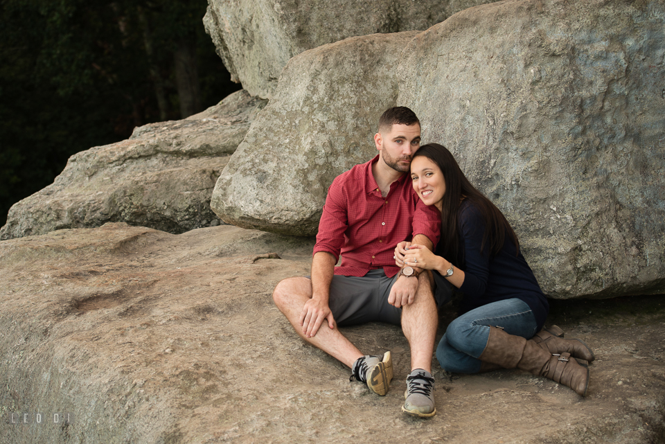 Rocks State Park Bel Air Maryland engaged girl leaning on fiance photo by Leo Dj Photography.