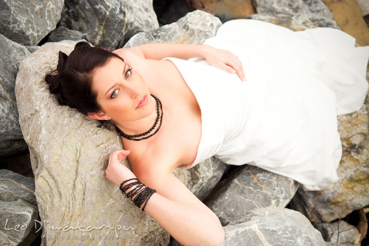 bride laying on the rock. Bridal portrait session model photography - Annapolis photographer