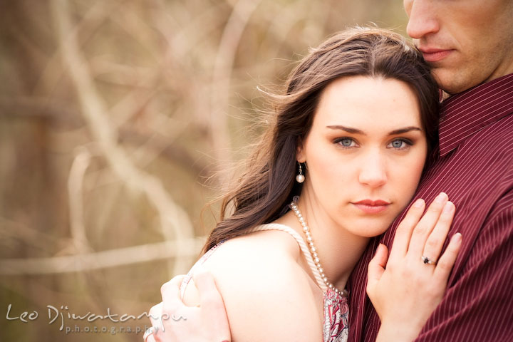 Girl hugged by guy, looking at camera. Engagement session model photography - Annapolis photographer