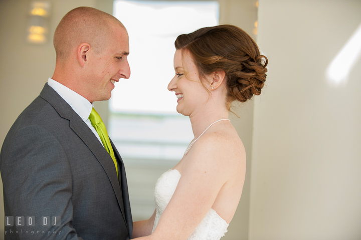 Bride and Groom smiling and embracing each other during first reveal. Hyatt Regency Chesapeake Bay wedding at Cambridge Maryland, by wedding photographers of Leo Dj Photography. http://leodjphoto.com