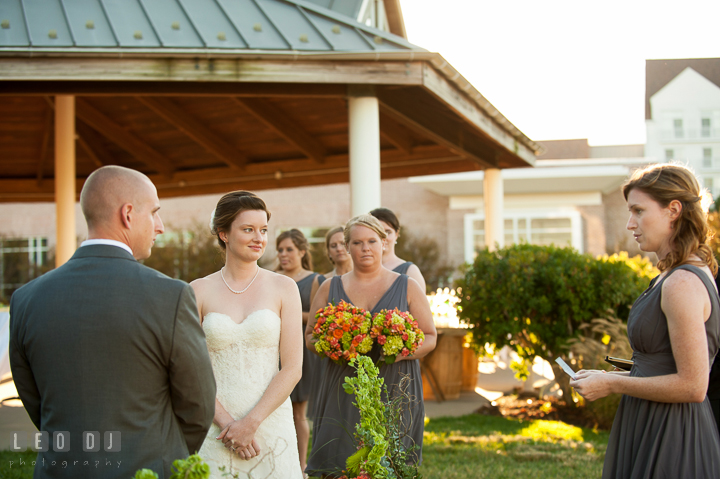 Bridesmaid Sister reading a passage to the Bride and Groom during the ceremony. Hyatt Regency Chesapeake Bay wedding at Cambridge Maryland, by wedding photographers of Leo Dj Photography. http://leodjphoto.com