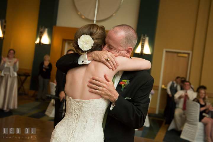 Father of the Bride hugged his Daughter tightly after parent dance. Hyatt Regency Chesapeake Bay wedding at Cambridge Maryland, by wedding photographers of Leo Dj Photography. http://leodjphoto.com