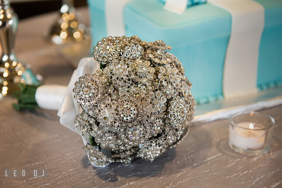 A bouquet of silver brooches from Rentals to Remember. Historic Events Annapolis bridal shower decor and event coverage at Annapolis Maryland, by wedding photographers of Leo Dj Photography. http://leodjphoto.com