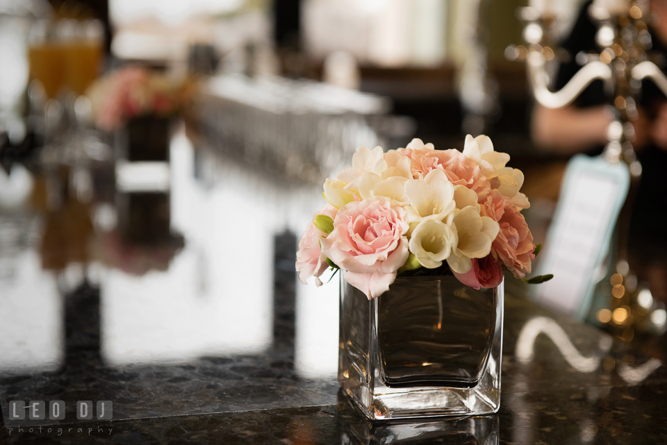 Arrangement of pink rose and white crocus on the bar table. Historic Events Annapolis bridal shower decor and event coverage at Annapolis Maryland, by wedding photographers of Leo Dj Photography. http://leodjphoto.com