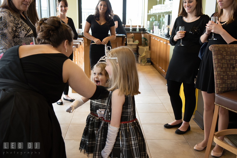 Bride-to-be about to hug the little princesses. Historic Events Annapolis bridal shower decor and event coverage at Annapolis Maryland, by wedding photographers of Leo Dj Photography. http://leodjphoto.com