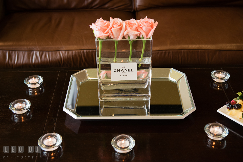 Four pink roses in Chanel No. 5 parfum vase. Historic Events Annapolis bridal shower decor and event coverage at Annapolis Maryland, by wedding photographers of Leo Dj Photography. http://leodjphoto.com