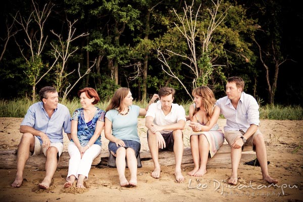 Family sitting on a log on the beach. Kent Island Annapolis Candid Family Portrait Photo Session Photography Eastern Shore Maryland MD DC