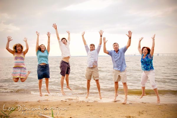 Family, mother, father, children jumping at Chesapeake Bay Beach. Kent Island Annapolis Candid Family Portrait Photo Session Photography Eastern Shore Maryland MD DC