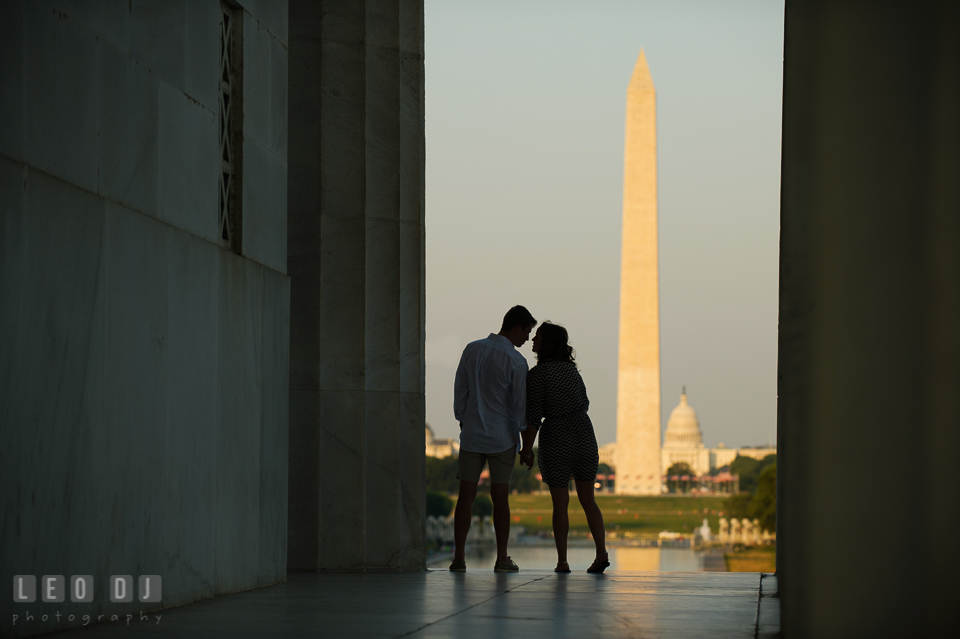 Engaged couple almost kissed with Washington monument and the Capitol in the background. Washington DC pre-wedding engagement photo session at Lincoln Memorial, by wedding photographers of Leo Dj Photography. http://leodjphoto.com