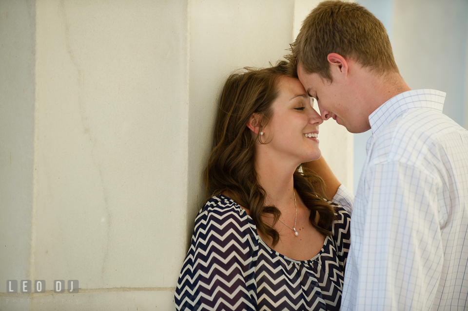 Engaged guy leaning head against his fiancée. Washington DC pre-wedding engagement photo session at Lincoln Memorial, by wedding photographers of Leo Dj Photography. http://leodjphoto.com