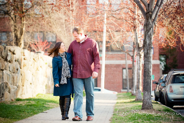 Engaged couple walking and smiling down the sidewalk. Pre-wedding Engagement Photo Session Federal Hill Baltimore and Mother's Grille restaurant bar by wedding photographer Leo Dj Photography