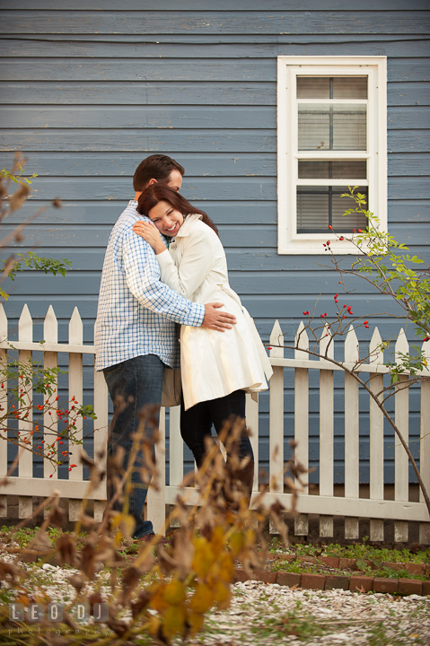 Engaged girl hugging and leaning to her fiancé. Annapolis Eastern Shore Maryland pre-wedding engagement photo session at downtown, by wedding photographers of Leo Dj Photography. http://leodjphoto.com