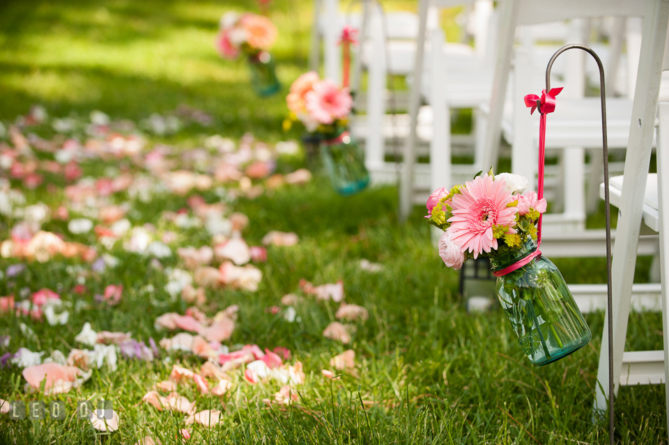 Rows of gerbera daisies for aisle decorations from florist Magnolia Floral Design. Chesapeake Bay Environmental Center, Eastern Shore Maryland, wedding reception and ceremony photo, by wedding photographers of Leo Dj Photography. http://leodjphoto.com