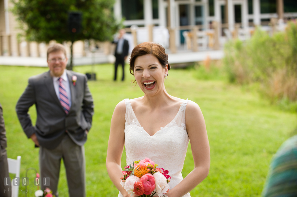 Bride happy seeing Groom for the first time during the ceremony after escorted by Father. Chesapeake Bay Environmental Center, Eastern Shore Maryland, wedding reception and ceremony photo, by wedding photographers of Leo Dj Photography. http://leodjphoto.com