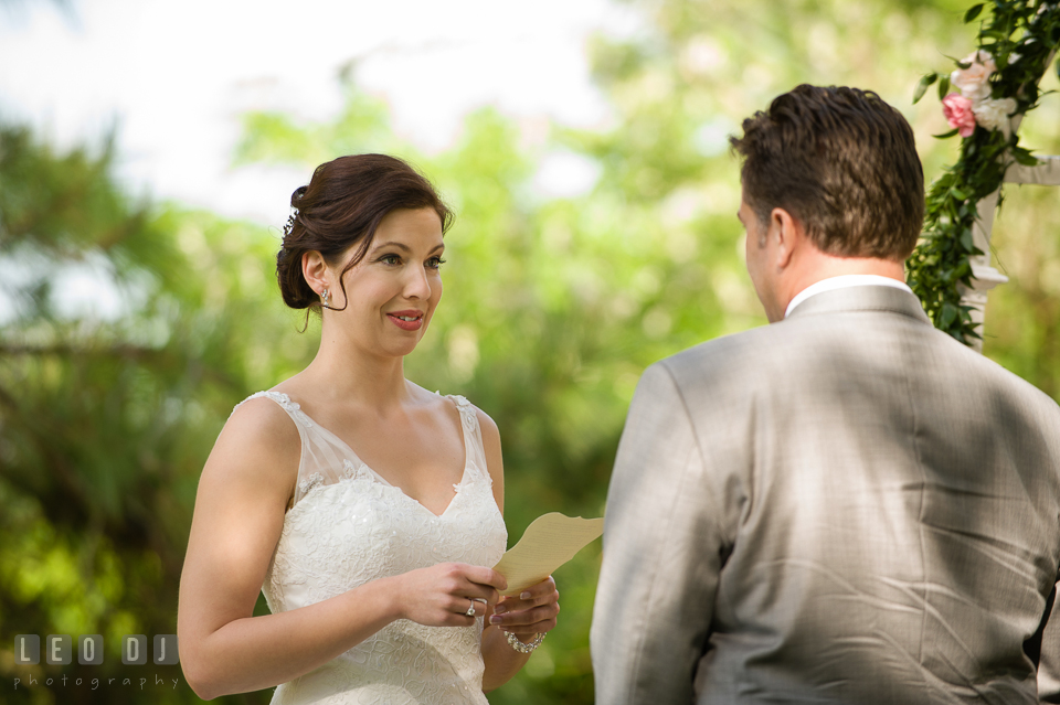 Bride reading her wedding vow. Chesapeake Bay Environmental Center, Eastern Shore Maryland, wedding reception and ceremony photo, by wedding photographers of Leo Dj Photography. http://leodjphoto.com