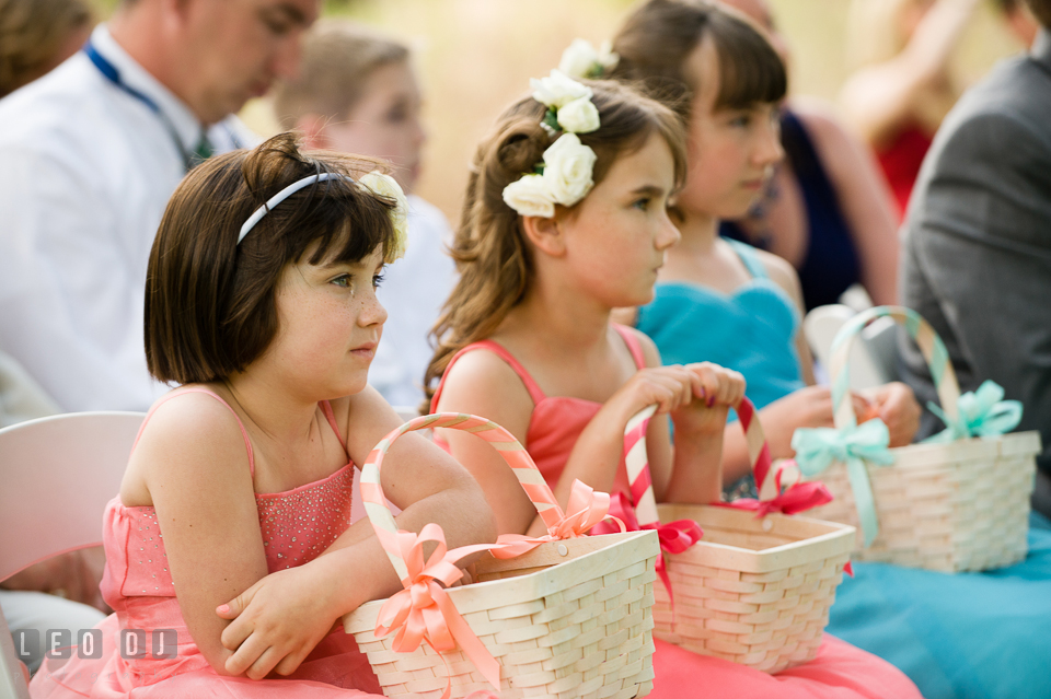 Overwhelmed by emotion, the young flower girl shed tears during the wedding ceremony. Chesapeake Bay Environmental Center, Eastern Shore Maryland, wedding reception and ceremony photo, by wedding photographers of Leo Dj Photography. http://leodjphoto.com