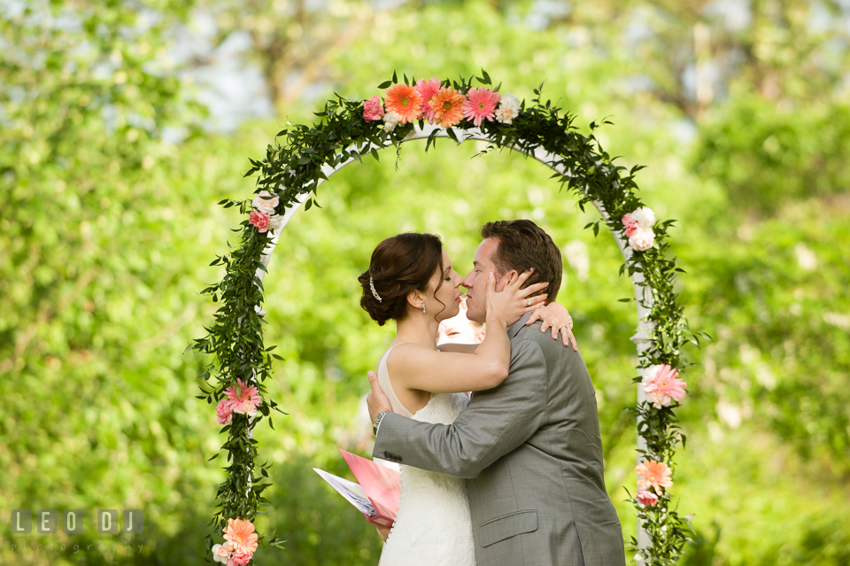 Bride and Groom's first kiss. Chesapeake Bay Environmental Center, Eastern Shore Maryland, wedding reception and ceremony photo, by wedding photographers of Leo Dj Photography. http://leodjphoto.com