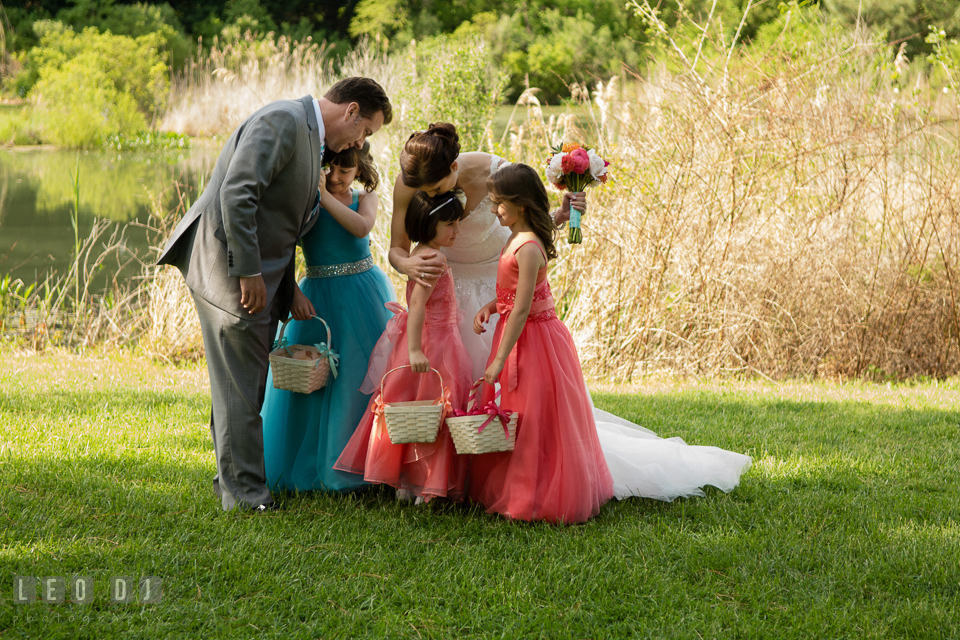 Bride and Groom hugging their children and flower girls after the ceremony. Chesapeake Bay Environmental Center, Eastern Shore Maryland, wedding reception and ceremony photo, by wedding photographers of Leo Dj Photography. http://leodjphoto.com