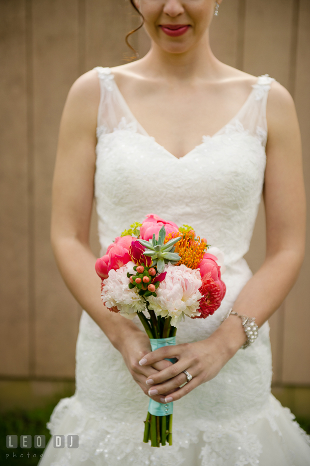 Bride's bouquet of dark and light pink peonies, succulents, protea, hypericum berries, and peach dahlias designed by the florist Magnolia Floral Design. Chesapeake Bay Environmental Center, Eastern Shore Maryland, wedding reception and ceremony photo, by wedding photographers of Leo Dj Photography. http://leodjphoto.com